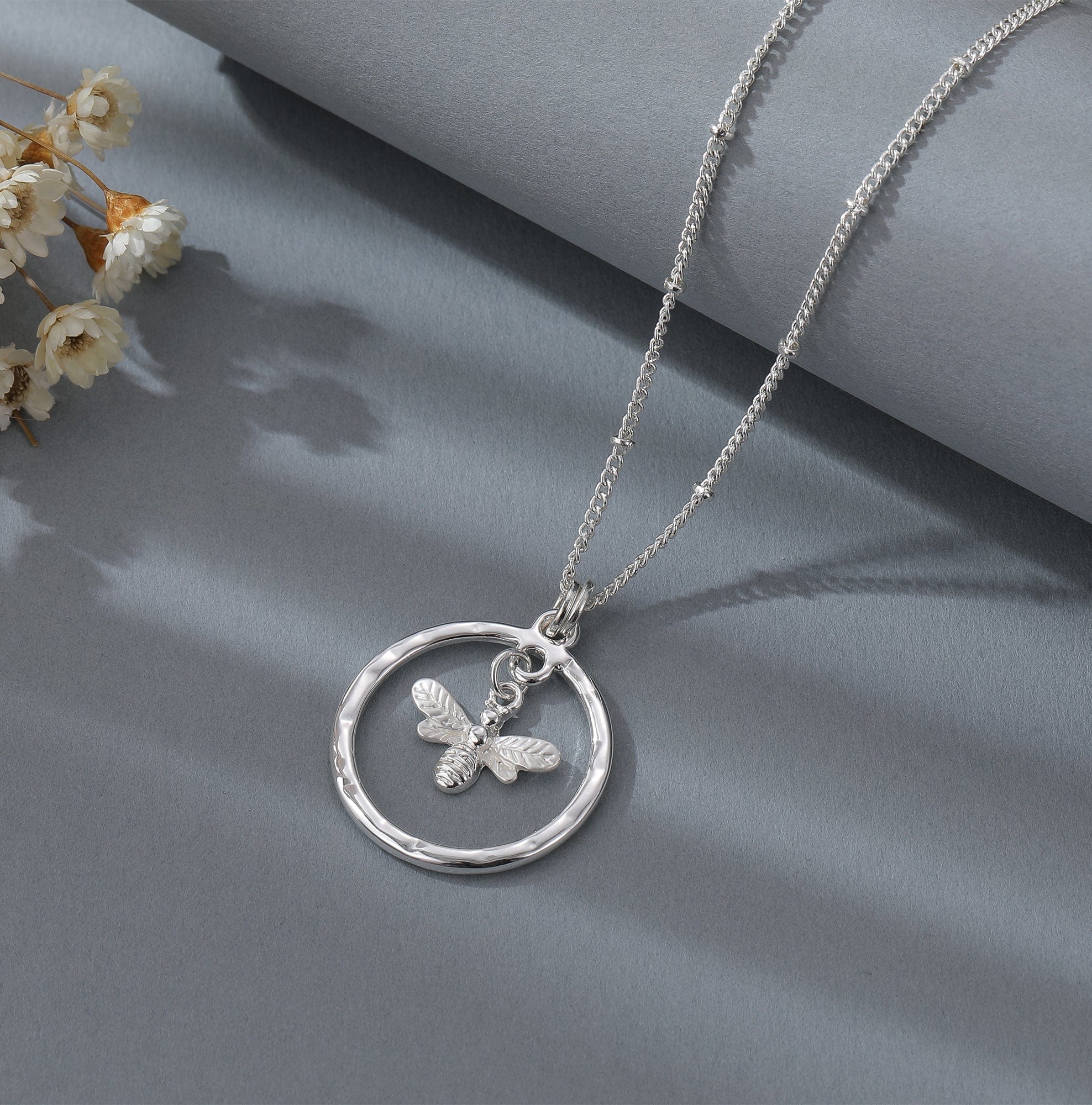 Silver necklace with hoop and bee charm - Image 4